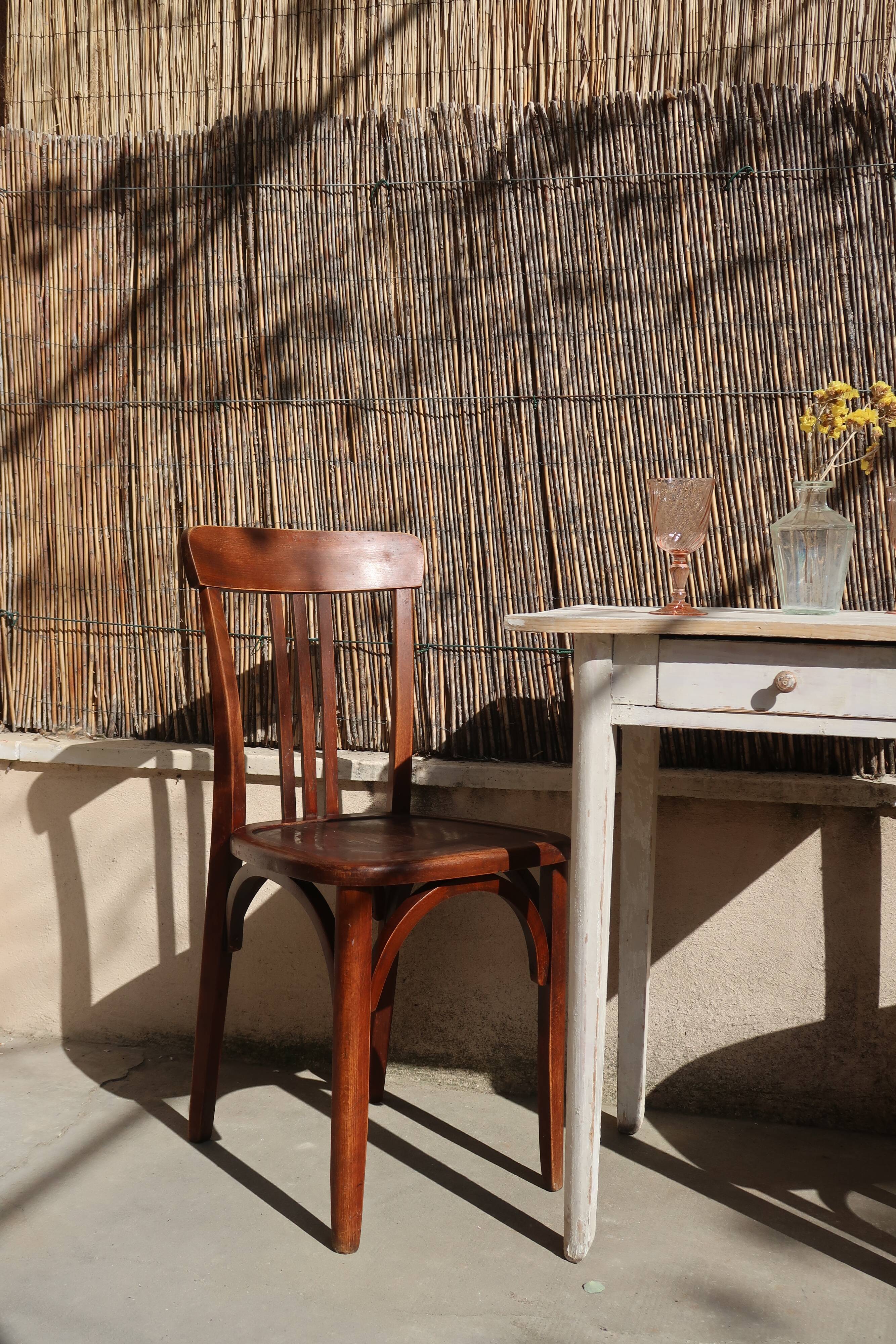 Pair of patinated bistro chairs