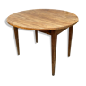 Round wooden farmhouse table with flaps