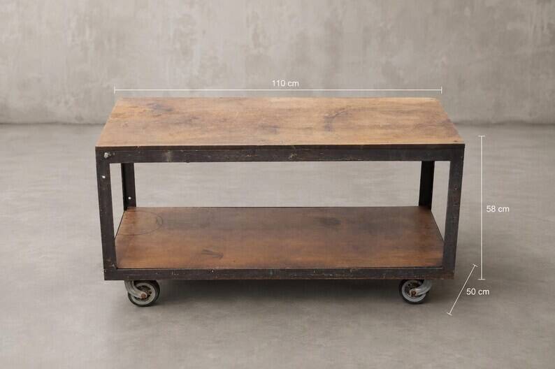Industrial coffee table in metal and wood, wheeled table, trolley, vintage table, interior decoration.
