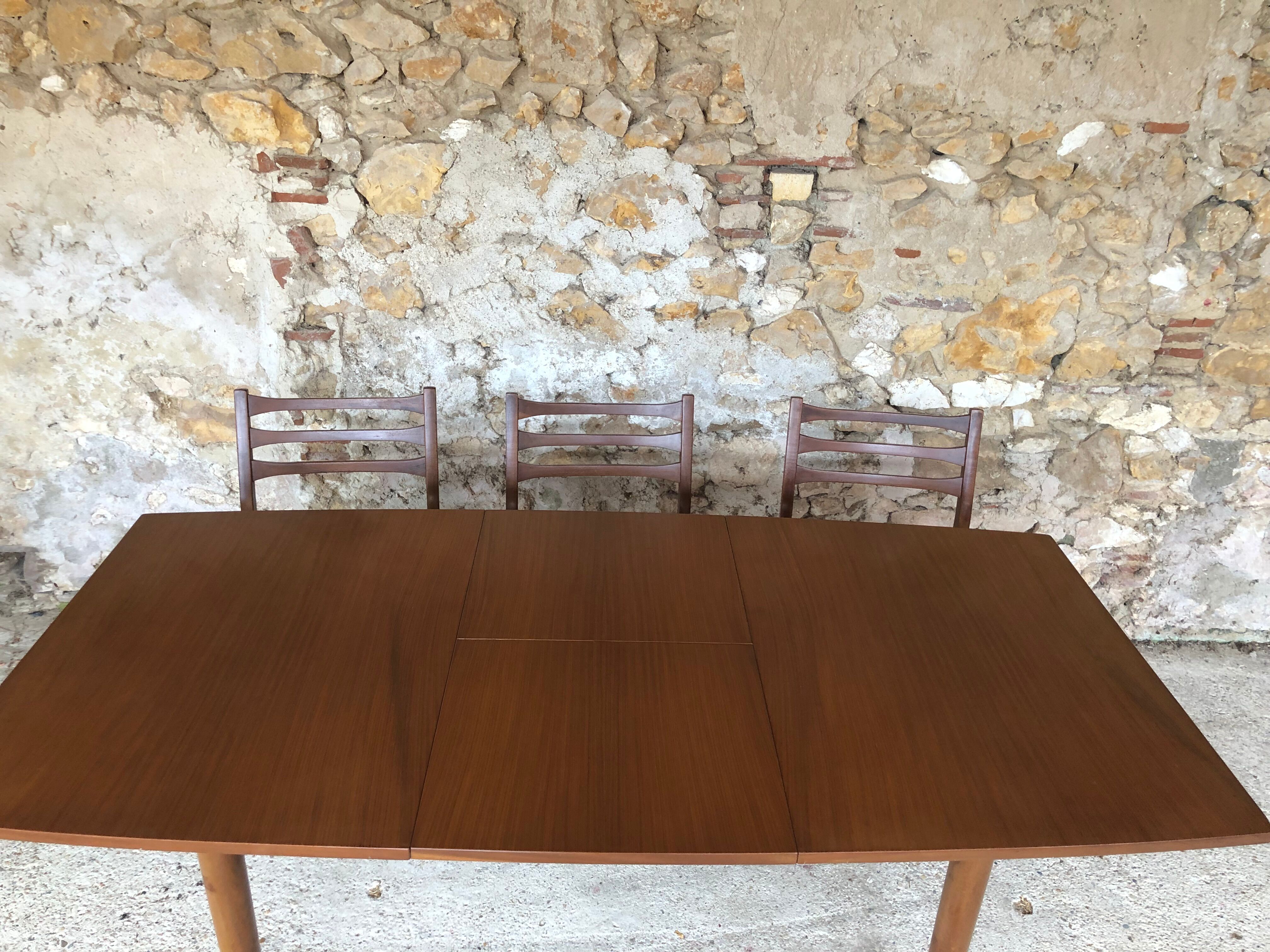 Scandinavian extension teak stretch table in butterfly ephardt by Meredew circa 60's