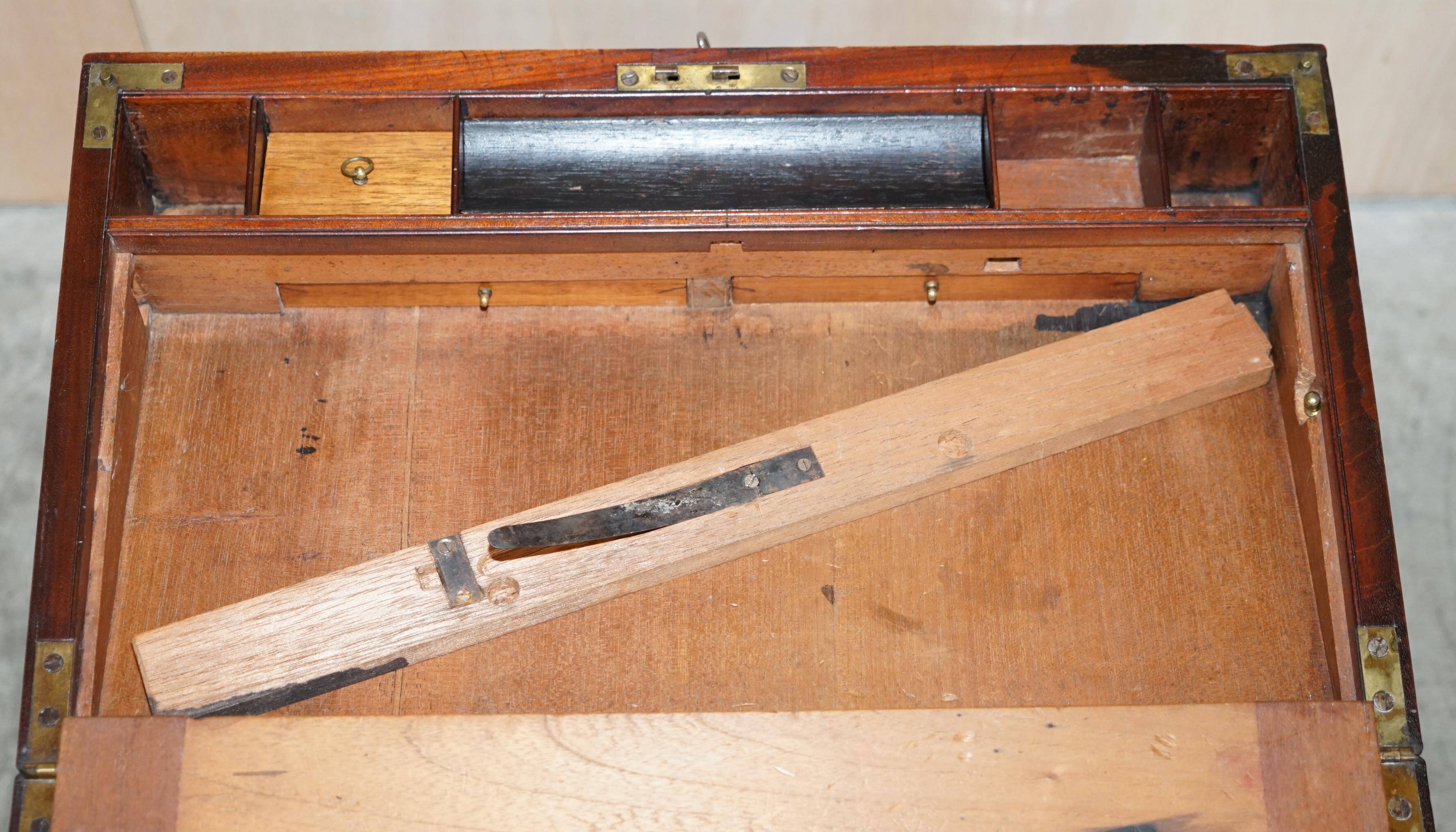 Antique hardwood military campaign desk with writing slope.