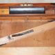 Antique hardwood military campaign desk with writing slope.