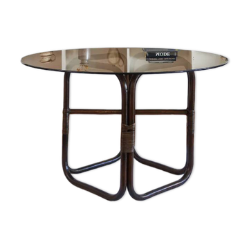 Round dining table in rattan, smoked glass top, 1970s.