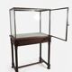 Antique display cabinet in 19th-century Gothic Revival style.