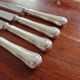 REX - Lot of 4 table knives model Chinon with silver-plated metal contour.