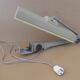 WALDMANN articulated workshop lamp with two industrial clamp arms for architects.