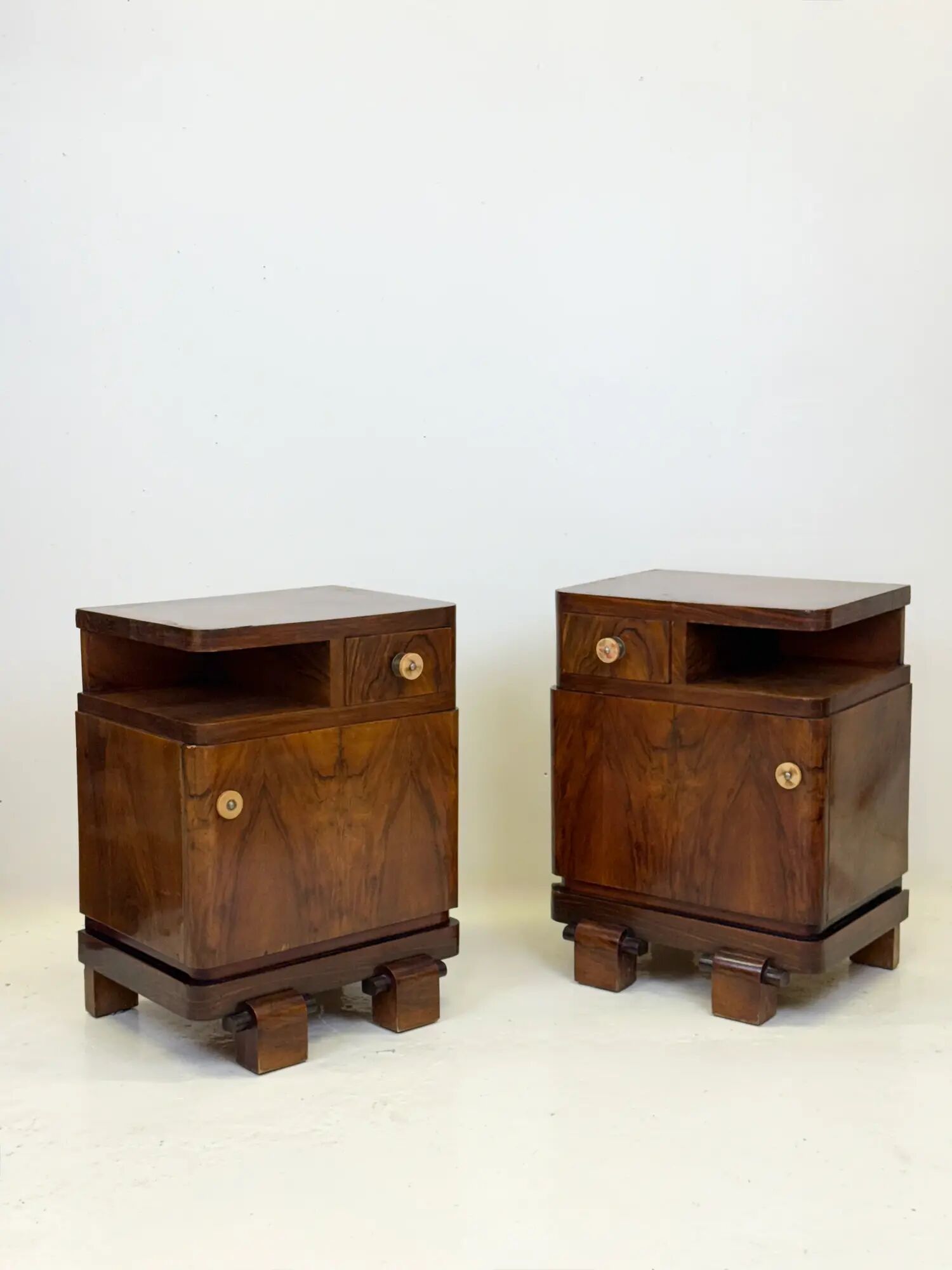 Pair of Art Deco bedside tables in walnut — Italy, 1930-1940