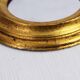 Golden oval mirror