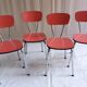 Suite de 4 chaises en formica rouge