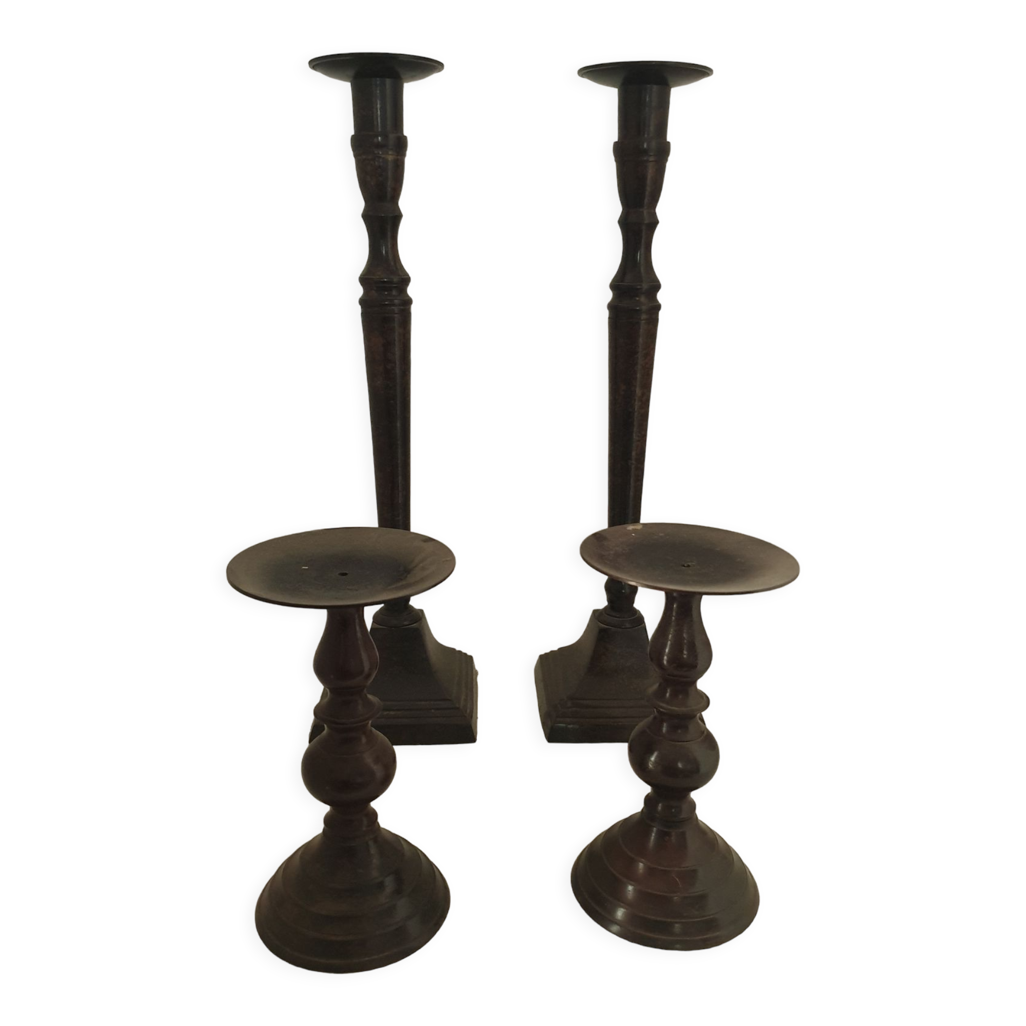 Two pairs of patinated brass candle holders