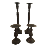 Two pairs of patinated brass candle holders