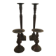 Two pairs of patinated brass candle holders
