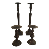 Two pairs of patinated brass candle holders