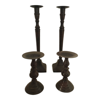 Two pairs of patinated brass candle holders