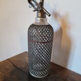 Old glass and metal siphon