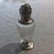 Crystal and solid silver shaker, neck brace and master's mark.