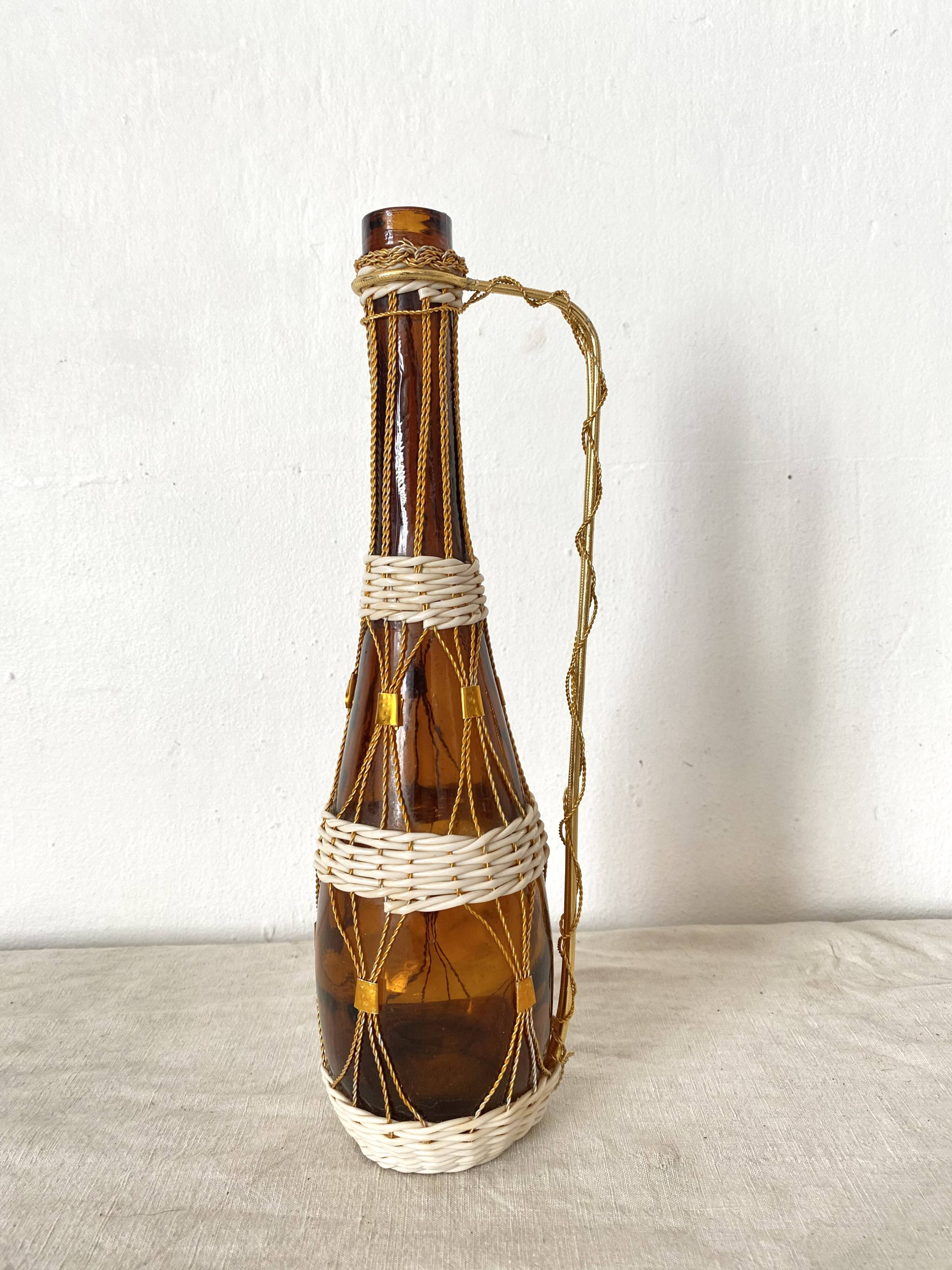 Amber glass bottle and scoubidou