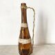 Amber glass bottle and scoubidou