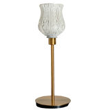 Table lamp with a white tulip lampshade and a gold base