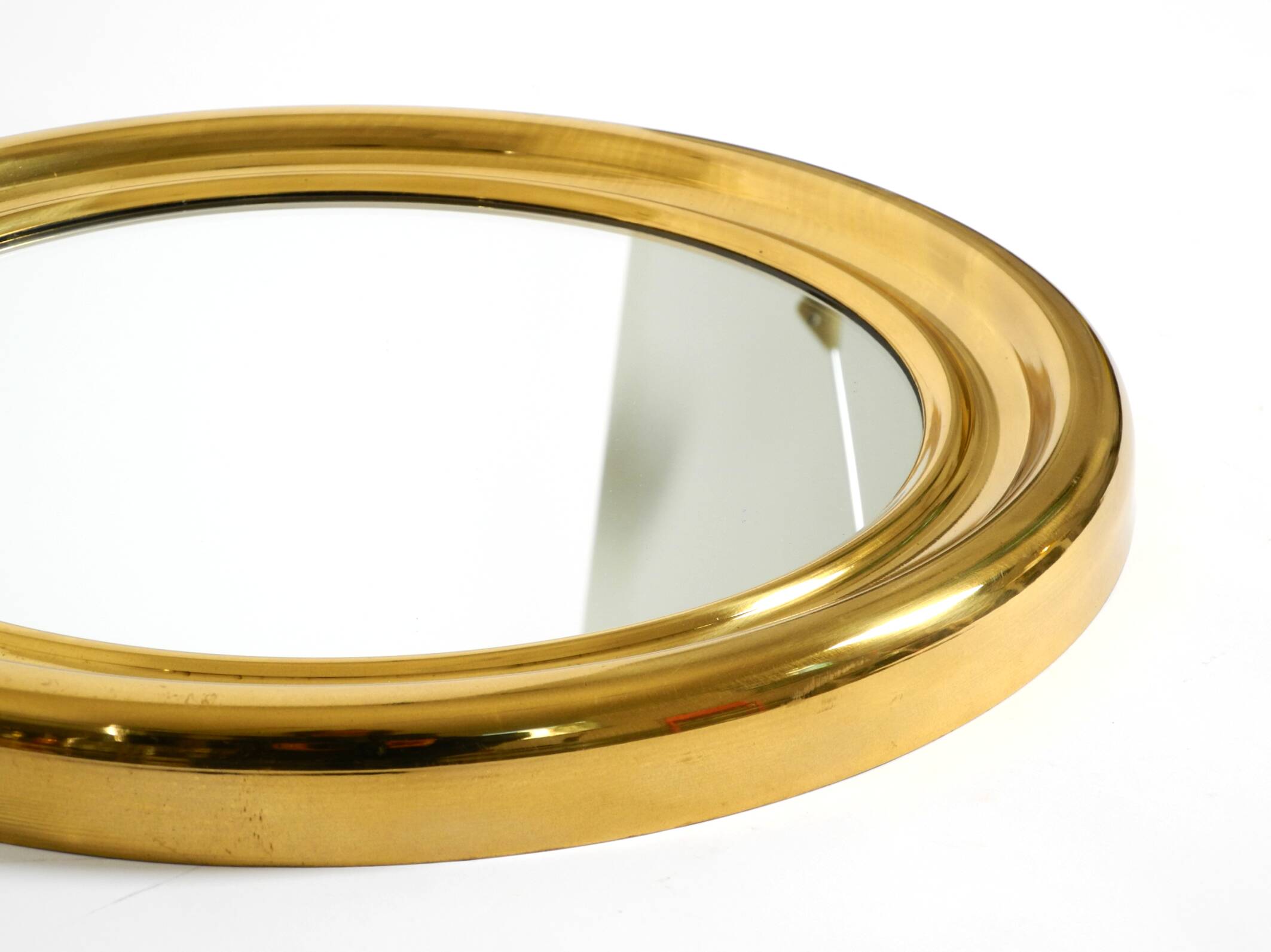 Beautiful, heavy, round Italian brass mirror from the 1960s