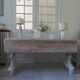 Console table in walnut with drop-leaf extensions, grey patinated base.