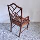 Fauteuil asiatique canné en bois à l'imitation du bambou