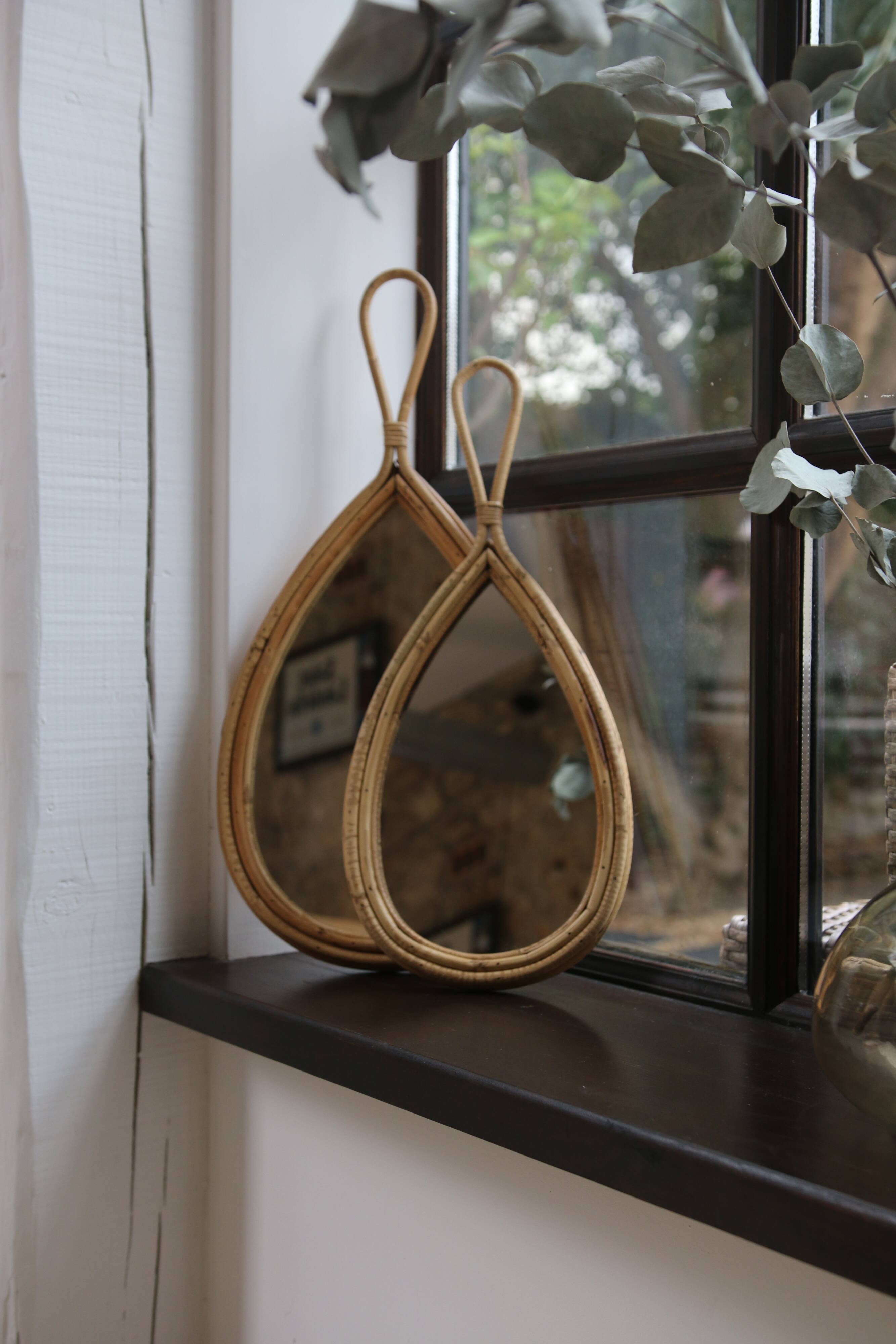Vintage teardrop rattan mirror