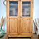 Glass-fronted cabinet in solid wood