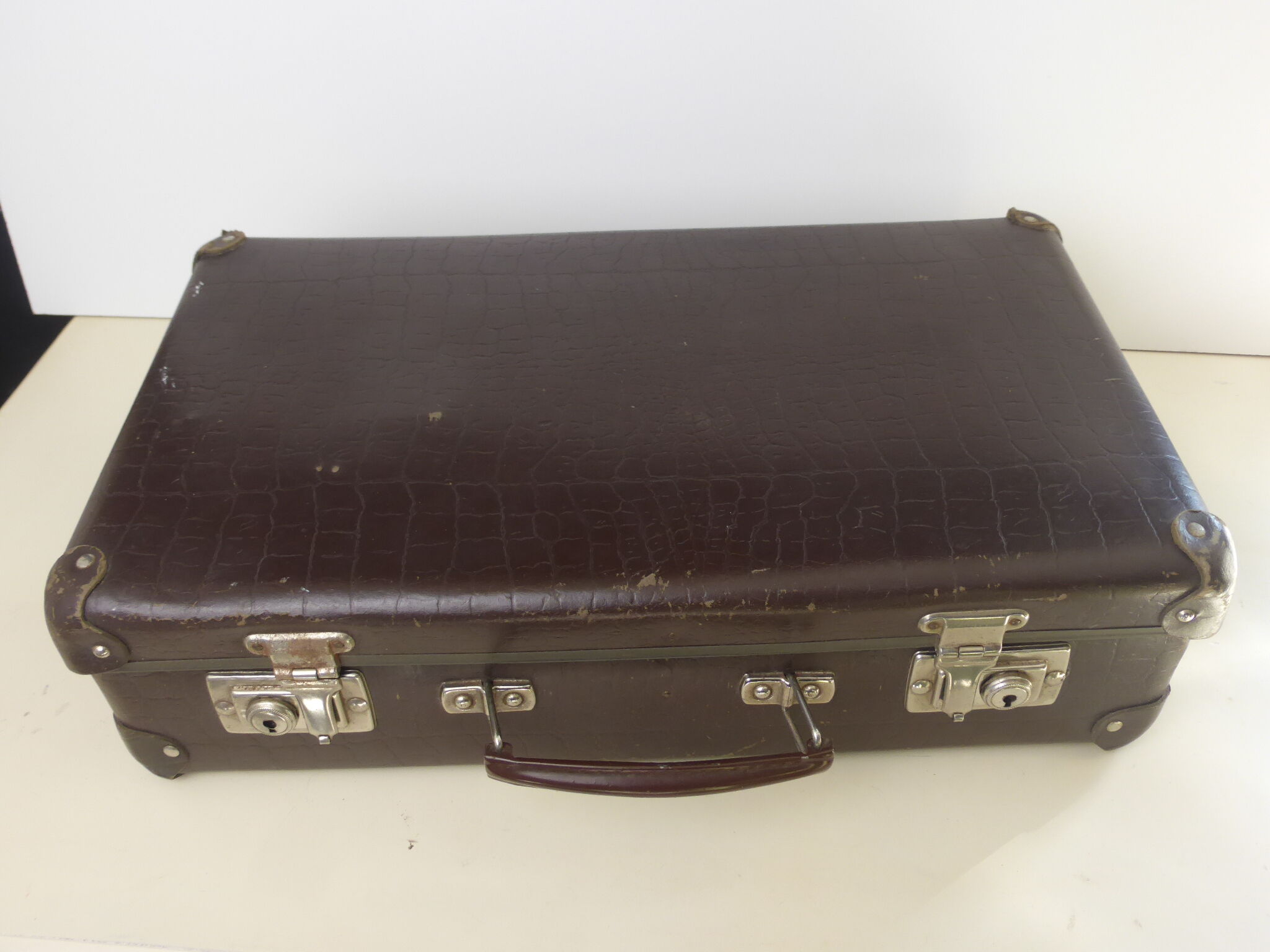 Old brown cardboard suitcase imitating the croco 50s/60s