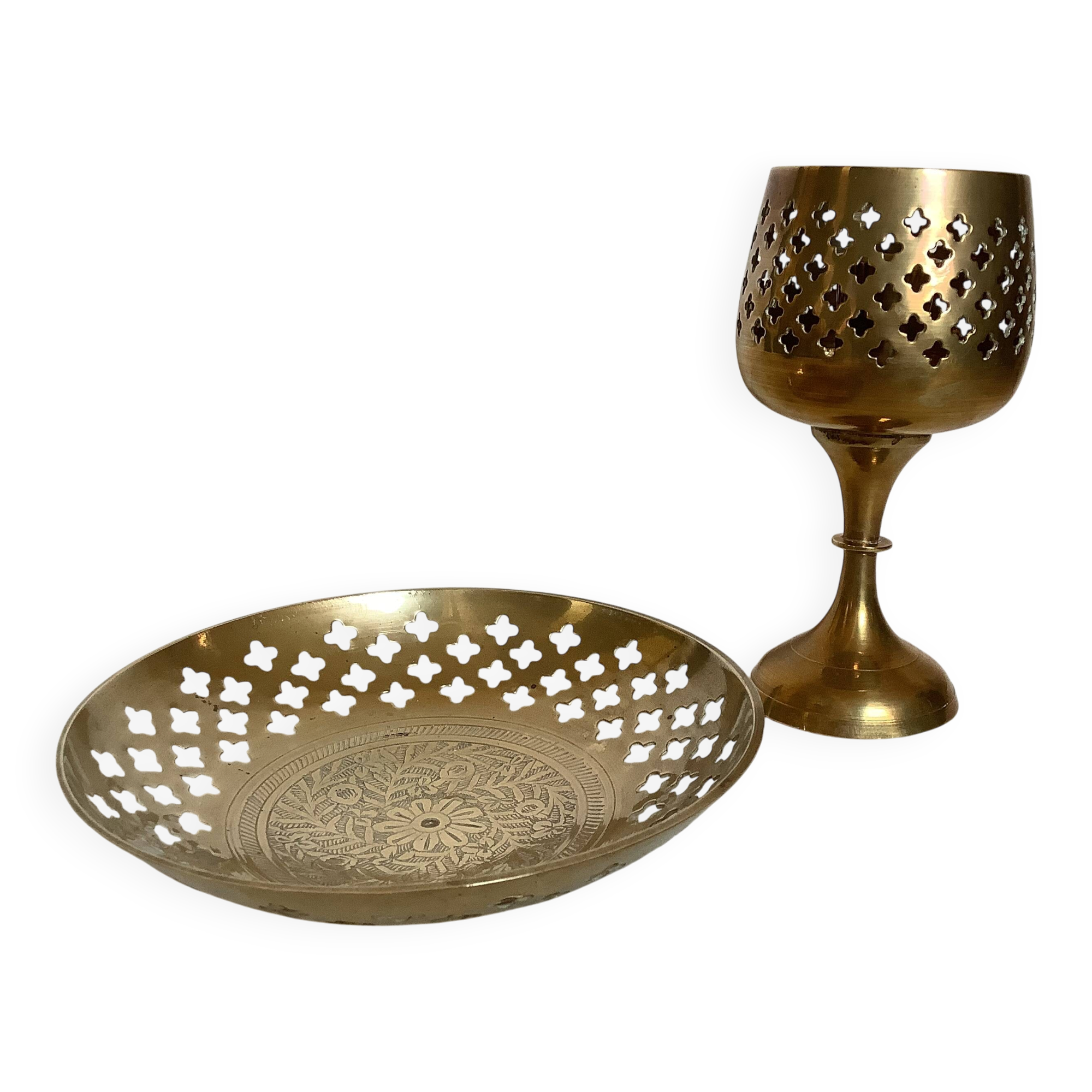 Lattice brass catchall and candlestick.