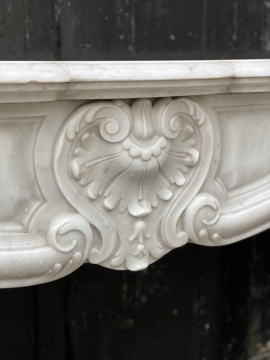 Louis XV style fireplace in Carrara marble