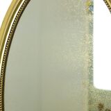 Miroir ovale classique doré à décor de ruban, France