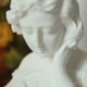 Limestone bust young girl who reads