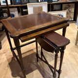 Classic nesting tables in wood and leather.