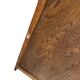 Vintage wooden display cabinet with textured glass.
