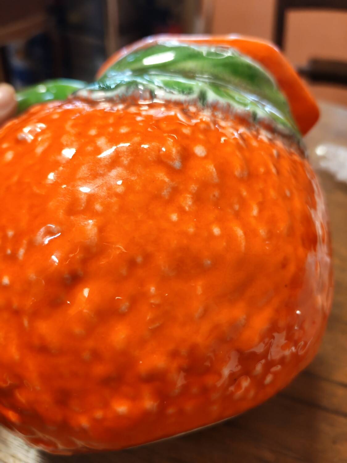 Orange slipware pitcher