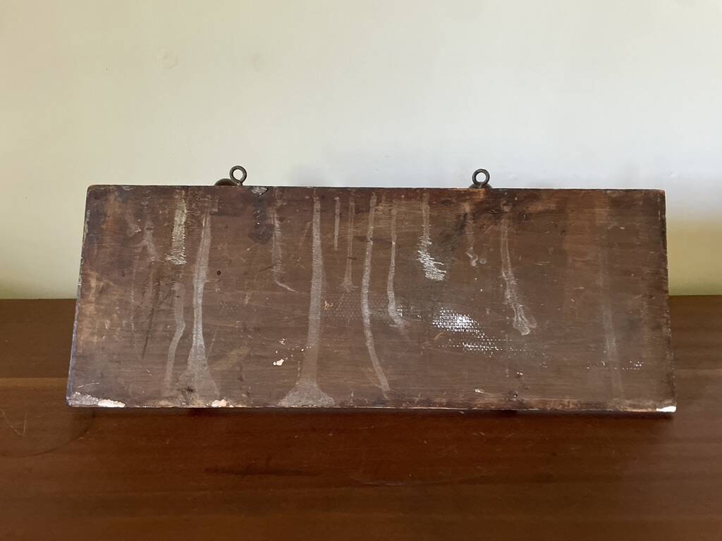 Patinated wood and metal coat rack from the 1950s.