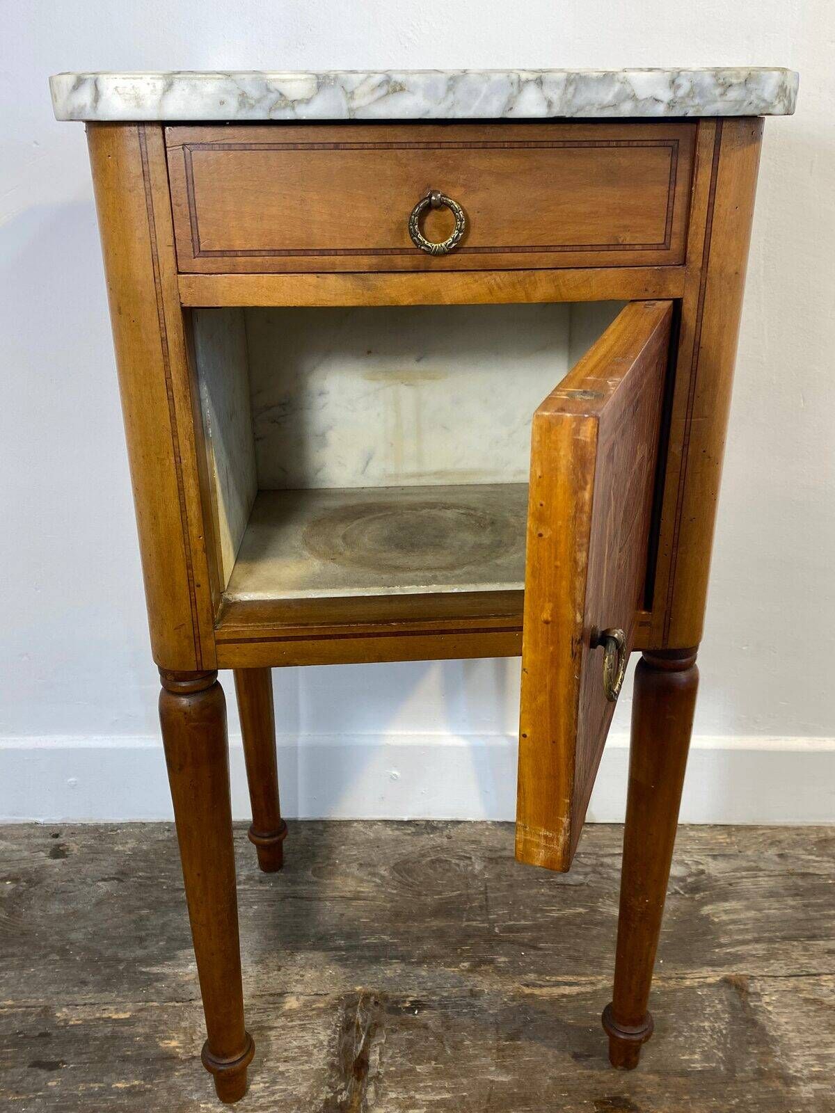 Louis XVI style bedside table, with a marble top and marquetry.