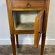 Louis XVI style bedside table, with a marble top and marquetry.