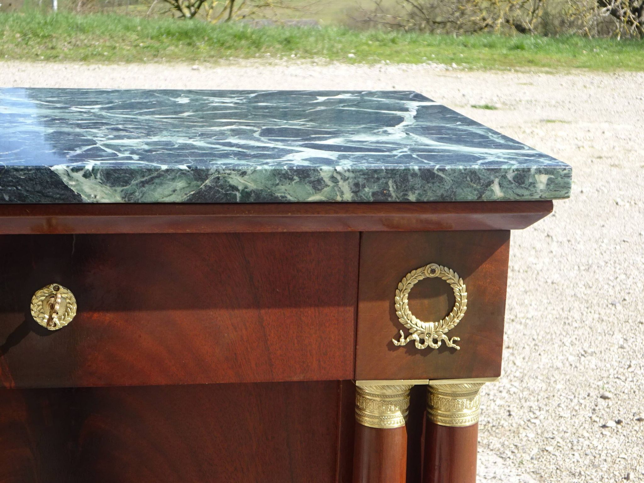 Flamed mahogany enfilade with sea green marble in Empire style.