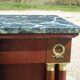 Flamed mahogany enfilade with sea green marble in Empire style.