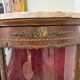 Corner display case in wood veneer with musical instrument marquetry