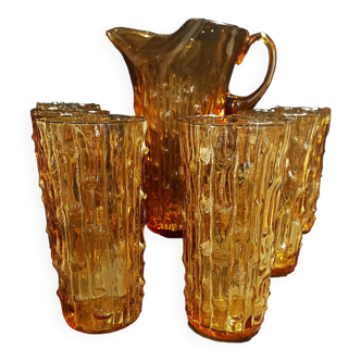 Orangeade service pitcher and six glasses textured amber glass Empoli Italy 1970