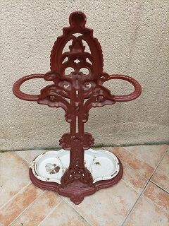 Patinated cast metal umbrella holder