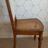 Solid oak art deco chair with cane and fabric.