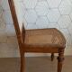 Solid oak art deco chair with cane and fabric.
