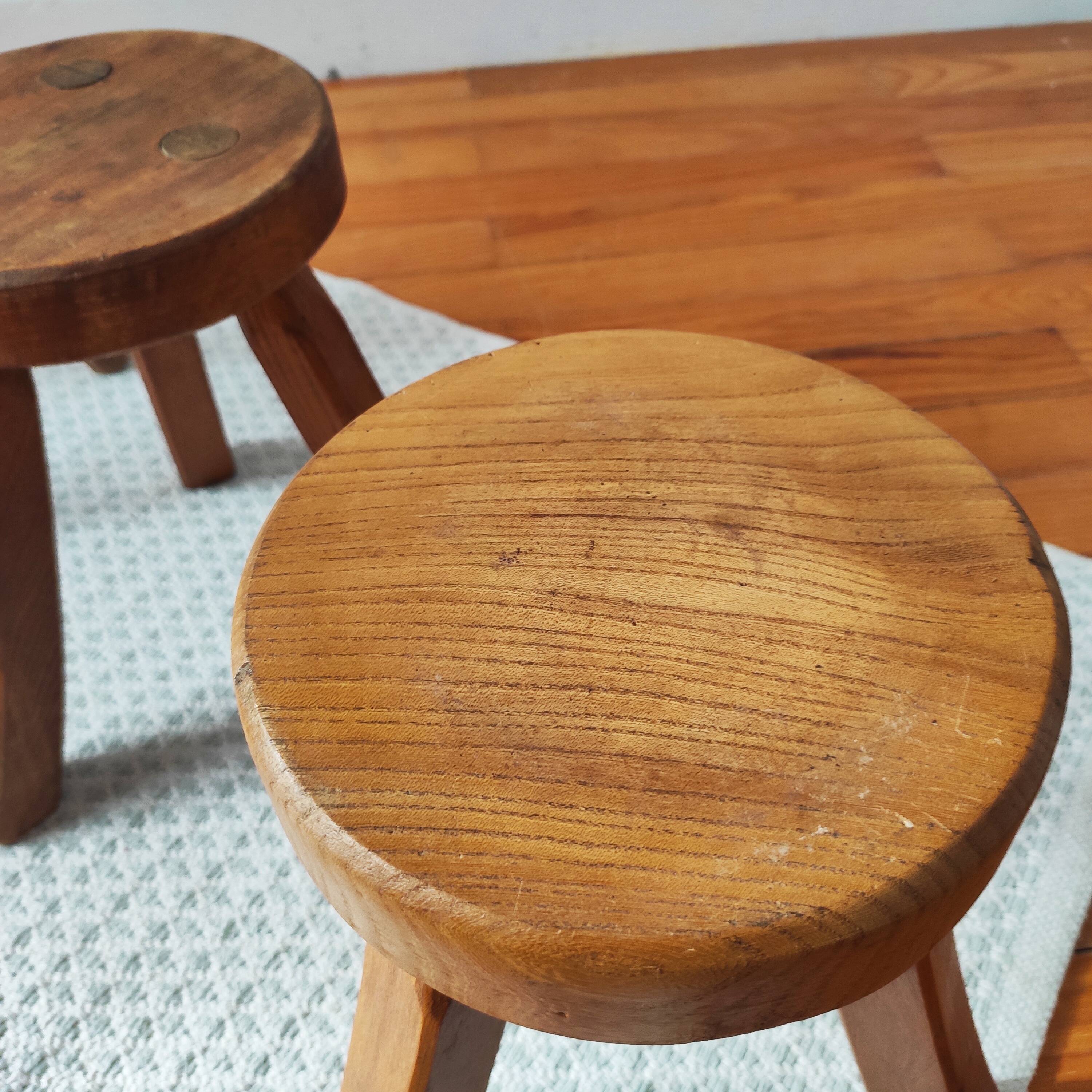 3 wooden tripod stools