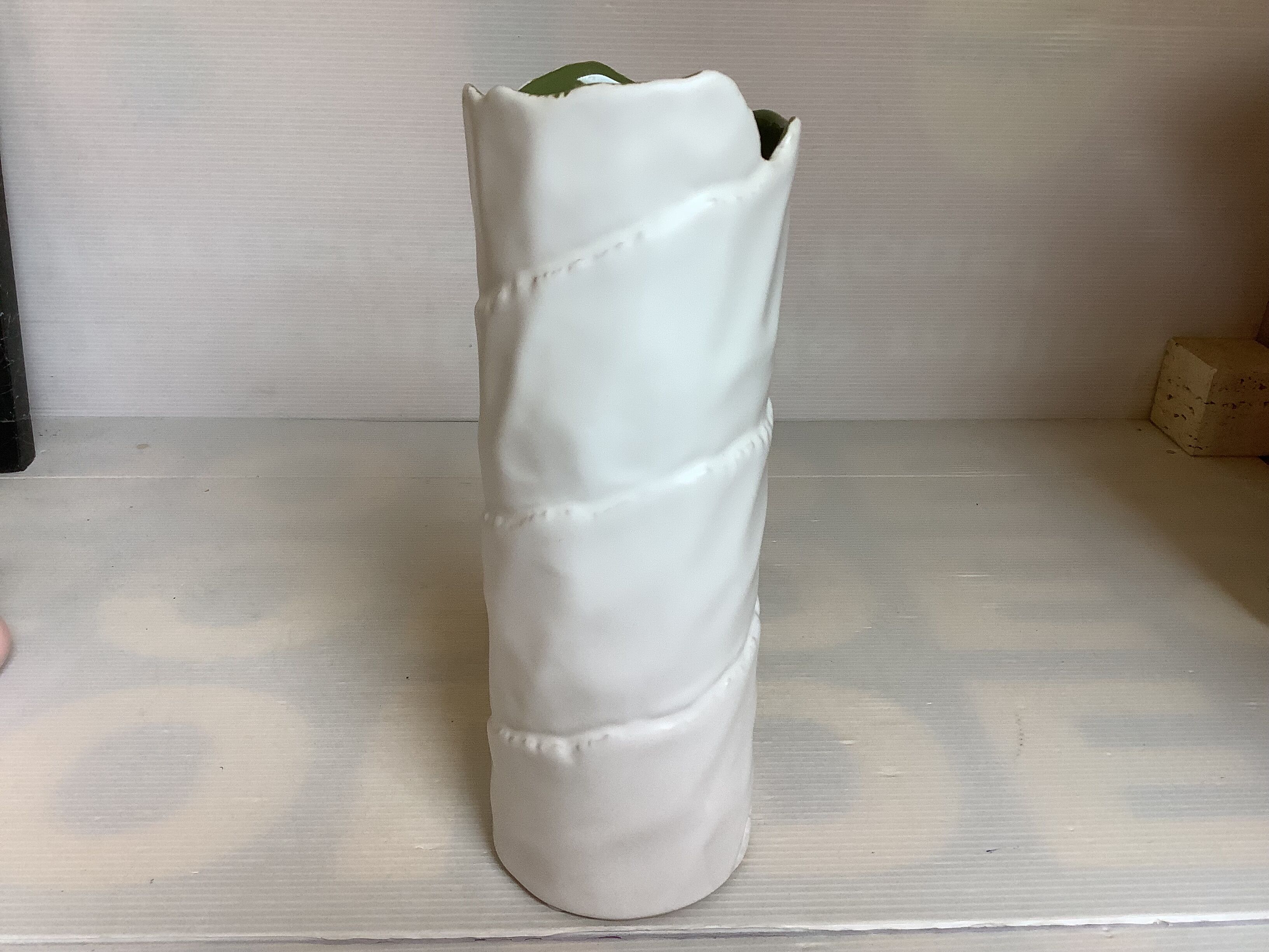 Vase with patterns of rolled paper leaves