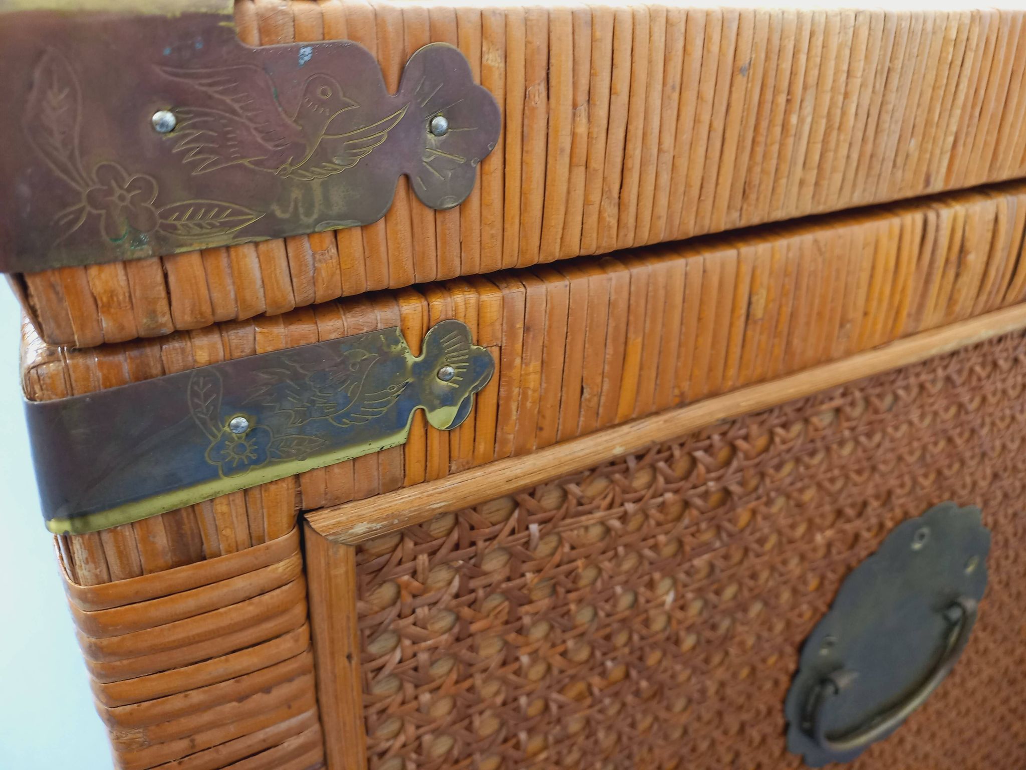Vintage trunk in wood, rattan, caning, and brass.