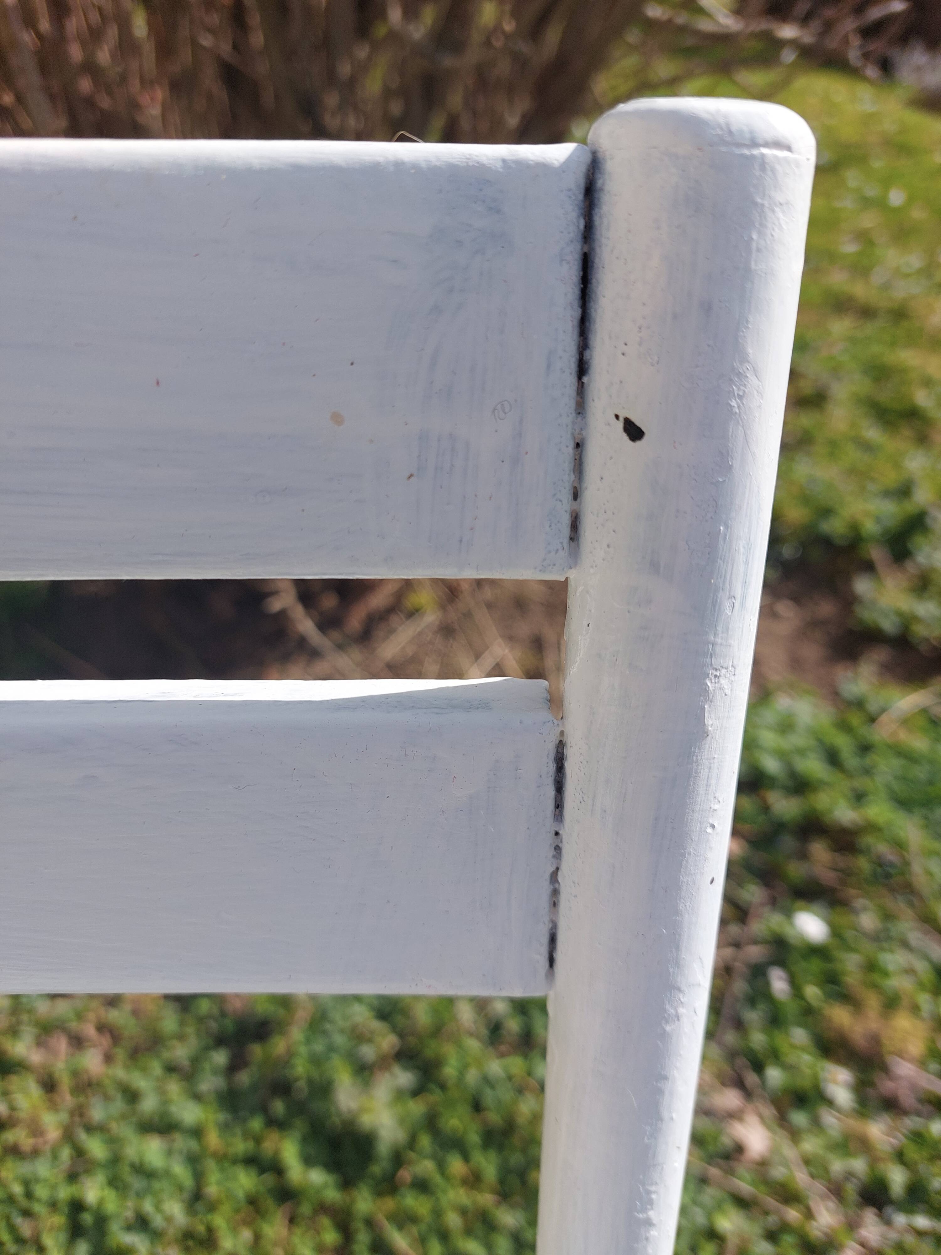 pair of white metal chairs, Tolix style